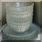 K26. Set of glass bowls and plates. 